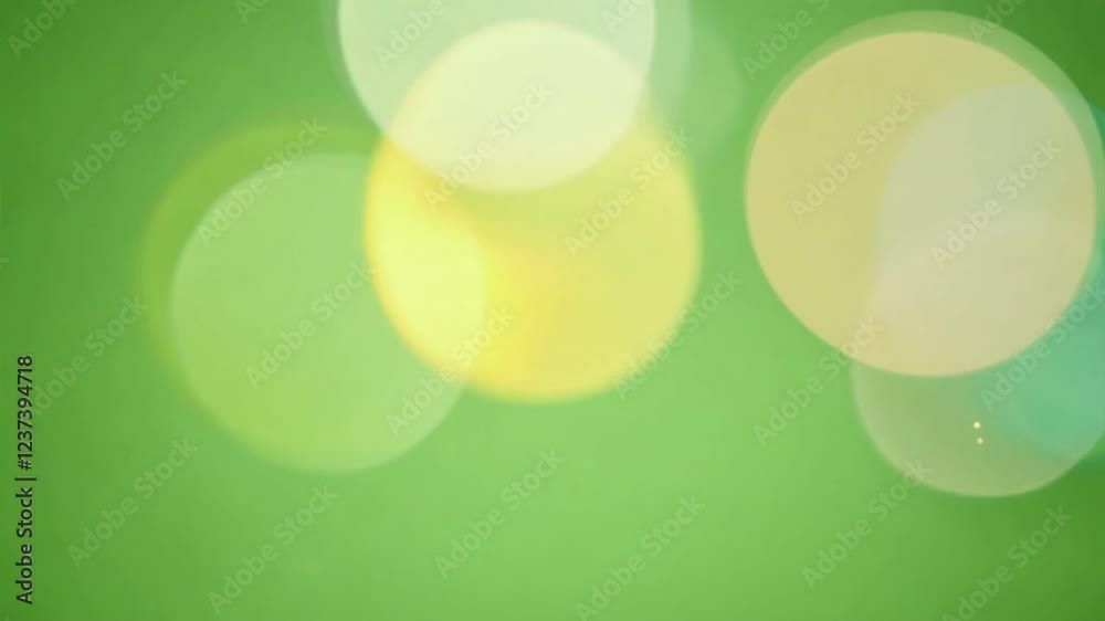 Wall mural green bokeh lights: abstract image of soft, pastel green bokeh lights, creating a dreamy and etherea