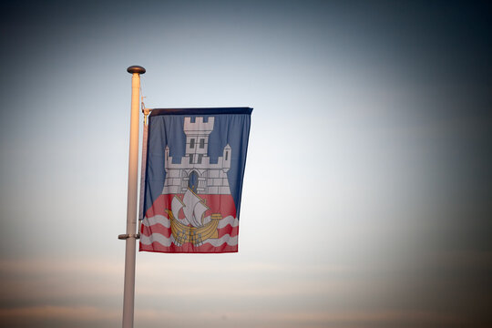 The official Belgrade flag, featuring the city&rsquo;s coat of arms, is hoisted against a clear sky. It is the official visual & symbol of belgrade, or beograd, the capital city and the main city of Serbia.