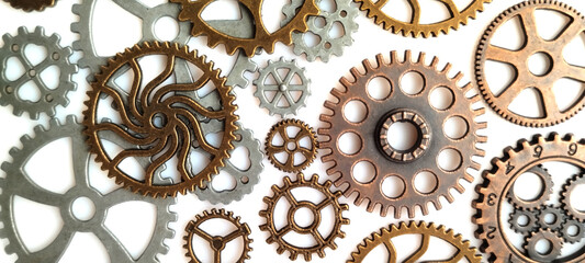 Mechanical gears arrangement industrial workshop close-up photography metal environment top-down view engineering concept