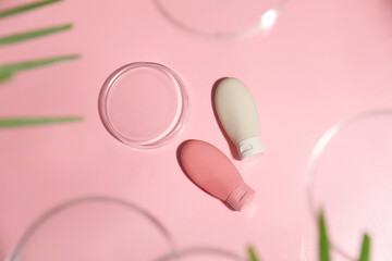 Stylish presentation of cosmetic products on pink background, flat lay