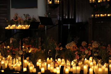 Candles adorning an altar in the church for a classical candlelight concert in the Short North,...