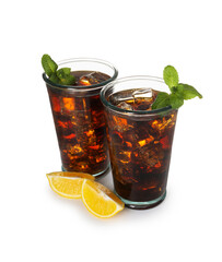 Refreshing cola with mint, ice cubes and slices of lemon in glasses isolated on white