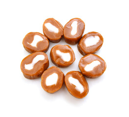 Caramel candies isolated on white background
