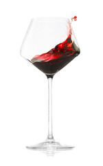 Red wine splashing in glass on white background