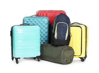 Colorful suitcases, bag and backpack isolated on white