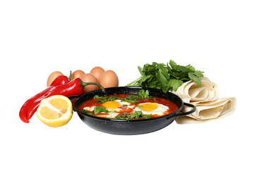PNG,Shakshuka in a bowl with fresh lemon and pepper, isolated on white background