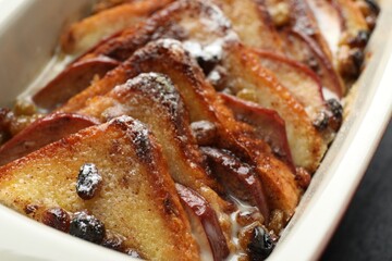 Freshly baked bread pudding in baking dish, closeup