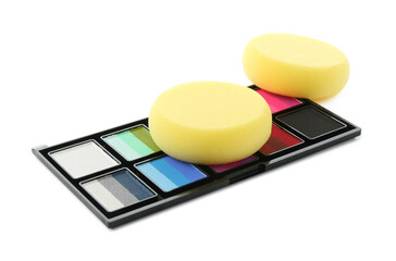 Bright face paint palette and sponges isolated on white