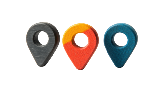 Three colorful wooden location pins on transparent background