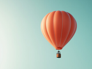 Obraz premium Orange Hot Air Balloon Soaring in Clear Blue Sky: Minimalist Adventure and Freedom Concept