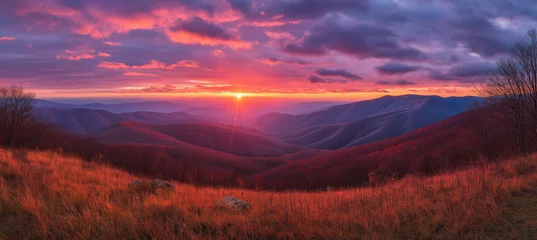 Amazing mountain landscape with colorful vivid sunset on the bright sky, natural outdoor travel background