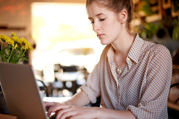 Laptop, research and woman in cafe with remote work, business ideas and social media management....