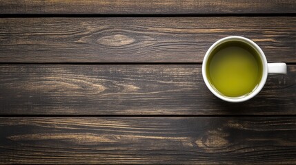 A cup of matcha tea, placed on a dark wooden surface, with a generous space for text