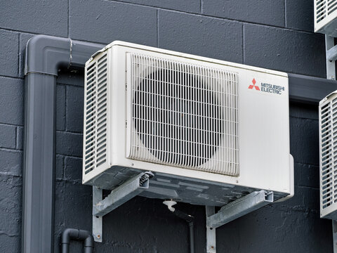 Mitsubishi Electric Air Conditioning Unit Mounted at Dark Wall