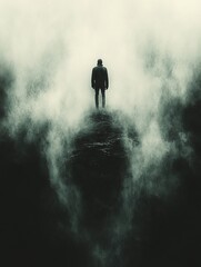 Lone man on foggy peak, contemplating abyss