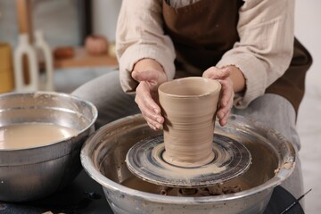 Hobby and craft. Woman making pottery indoors, closeup