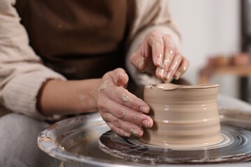 Hobby and craft. Woman making pottery indoors, closeup