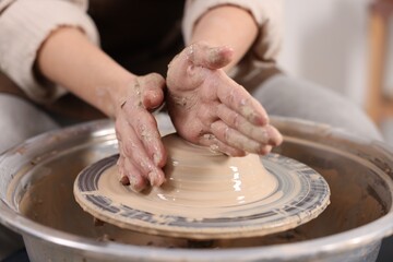 Hobby and craft. Woman making pottery indoors, closeup