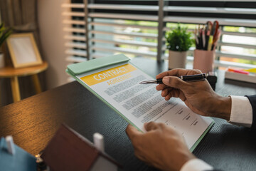 a real estate agent is explaining the details of a home purchase contract to a buyer, he is telling...