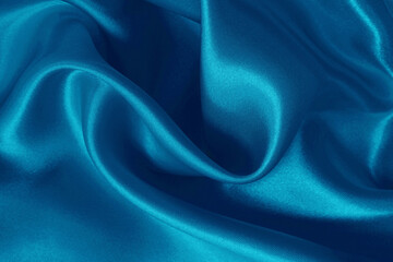 Blue fabric cloth texture for background and design art work, beautiful crumpled pattern of silk or linen.