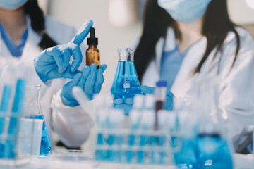 Fototapeta premium Microbiological research with a test tube and micropipette in close -up