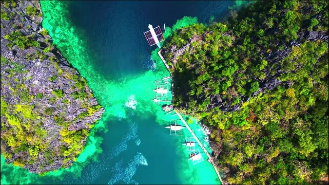 Aerial View of Tropical Island Cove with Bancas Docked