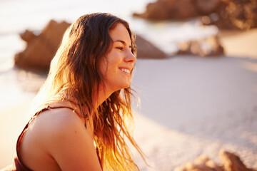 Relax, smile and travel with woman at beach for summer vacation, adventure and tropical destination. Holiday, peace and tourism with person on hill outdoor on coast for wellness, sunset and paradise