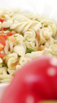 Bell pepper with bowl of pasta