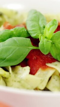 Cherry tomato with bowl of pasta