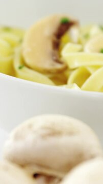 Mushroom with bowl of pasta