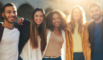 Hug, portrait and group of friends in city for smile, diversity and spring break. Students, summer vacation and college freshman with people in new york for solidarity, support or lens flare