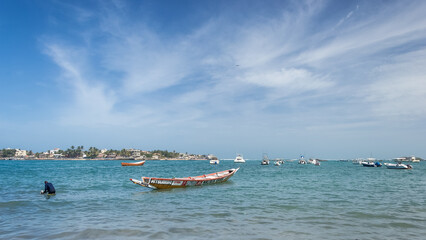 Dakar, Senegal – View of Petit Ngor Beach, the departure point for boats and ships heading to Ngor Island, a small island off the coast of Senegal, near Dakar, West Africa. © Mltz