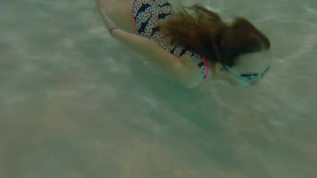 Kid Swimming Underwater