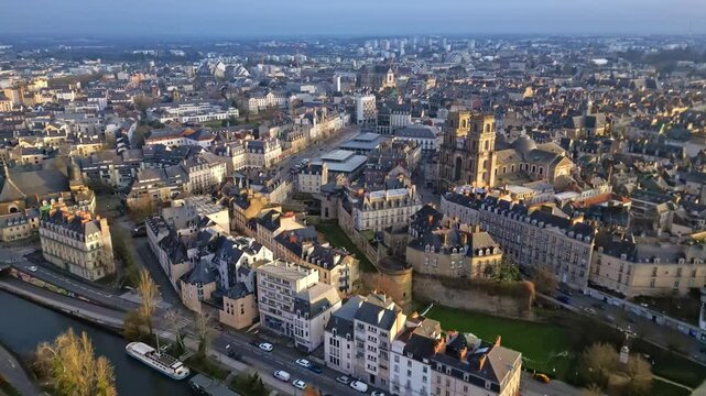 Cath&eacute;drale St Pierre, barges on Canal Saint Martin, Quai St Cyr, square and market of Lices, rennes cityscape, France. Aerial drone forward