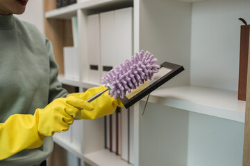 the housewife is cleaning the house, the wife is cleaning the house while waiting for her husband to com back form work, the cleaner is very attentive