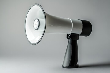 A white megaphone sits on a gray surface