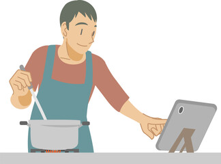 タブレットでレシピを確認しながら料理する男性