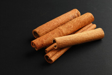 Cinnamon sticks on black background