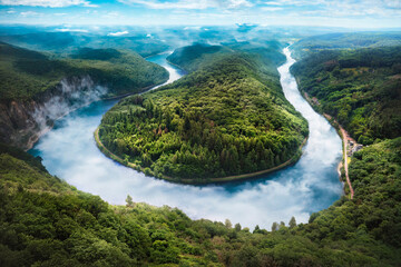 The image shows the Saarschleife near Mettlach (Orscholz, Saarland) in summer. The river Saar makes...