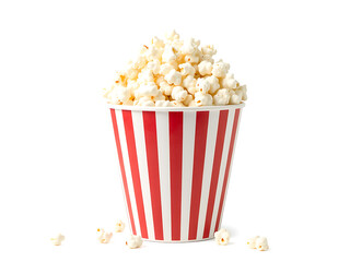 Popcorn in red and white striped bucket isolated on white background