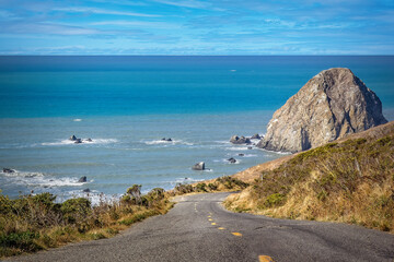 California State Highway No 1 leading to the blue Pacific ocean