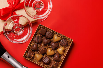 A glasses of champagne elegantly paired with a gift box