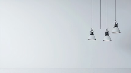 Three White Pendant Lights Against a White Wall