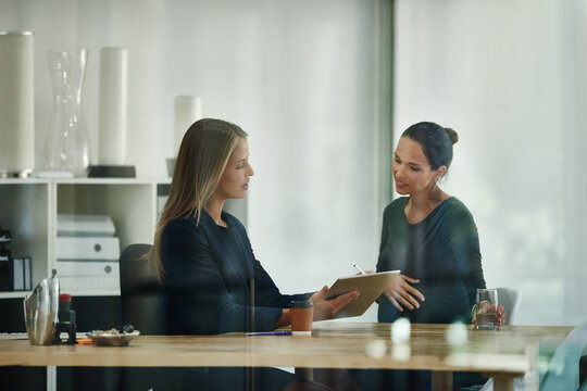 Tablet, business people and pregnant woman in office for meeting and professional advice. Teamwork, online or hr manager with assistant, help or schedule for maternity application or pregnancy leave