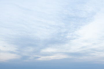 Fototapeta premium soft blue sky with textured clouds at dawn 