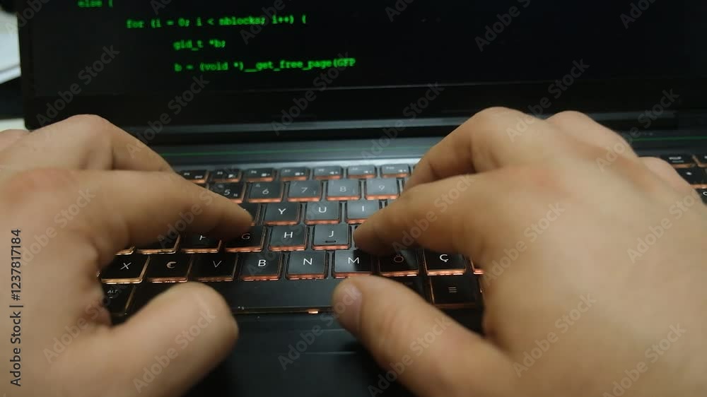 Wall mural close-up of a computer screen and a man writing code. cybersecurity, the concept of data security.
