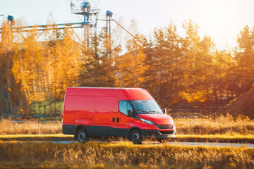Fototapeta premium Utility van moving through countryside