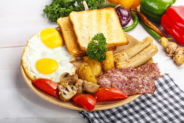 English breakfast with toast, egg and sausages