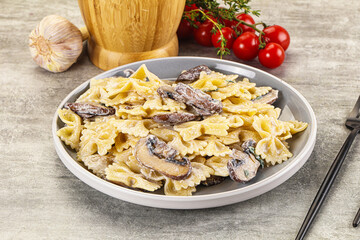 Italian cuisine - farfalle with mushrooms