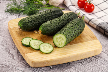 Raw green cucumbers with slices